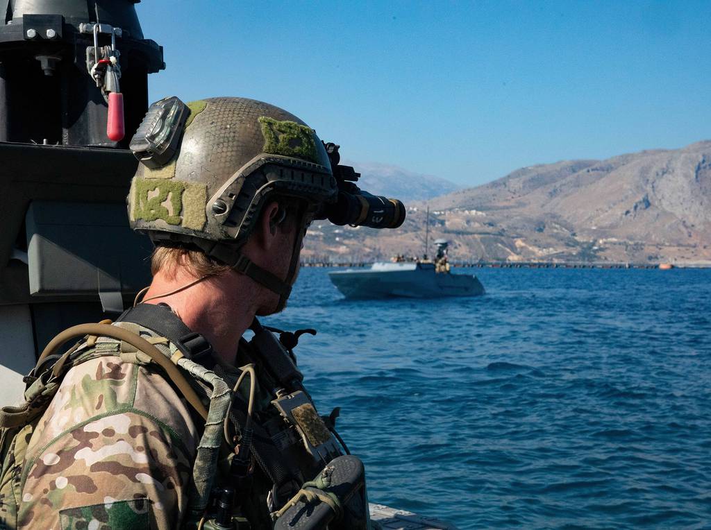 U.S. Naval Special Warfare operators and U.S. Navy Special Warfare combatant-craft crewmen prepare for a visit, board, search, and seizure exercise during a training mission at the NATO Maritime Interdiction Operational Training Center, Greece on July 31, 2020.