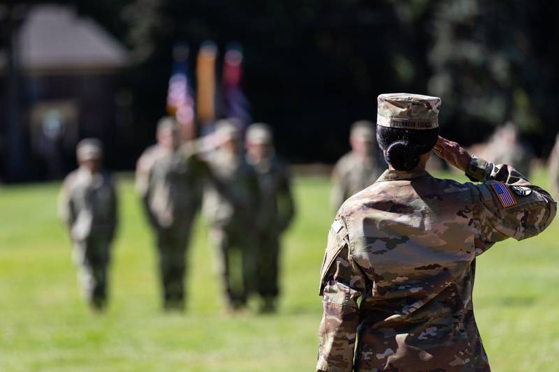 A corporal returns the first salute of her troops in a change of command ceremony on Joint Base Lewis-McChord, Wash., on Aug. 4, 2023.