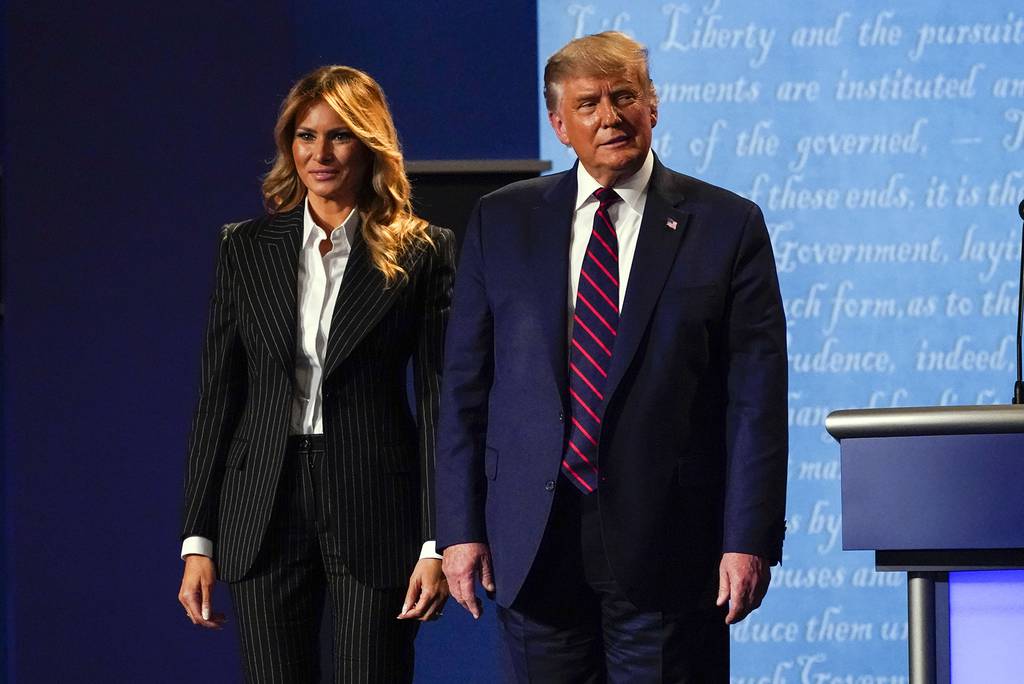 President Donald Trump stands on stage with first lady Melania Trump after the first presidential debate with Democratic presidential candidate former Vice President Joe Biden Tuesday, Sept. 29, 2020, at Case Western University and Cleveland Clinic, in Cleveland.