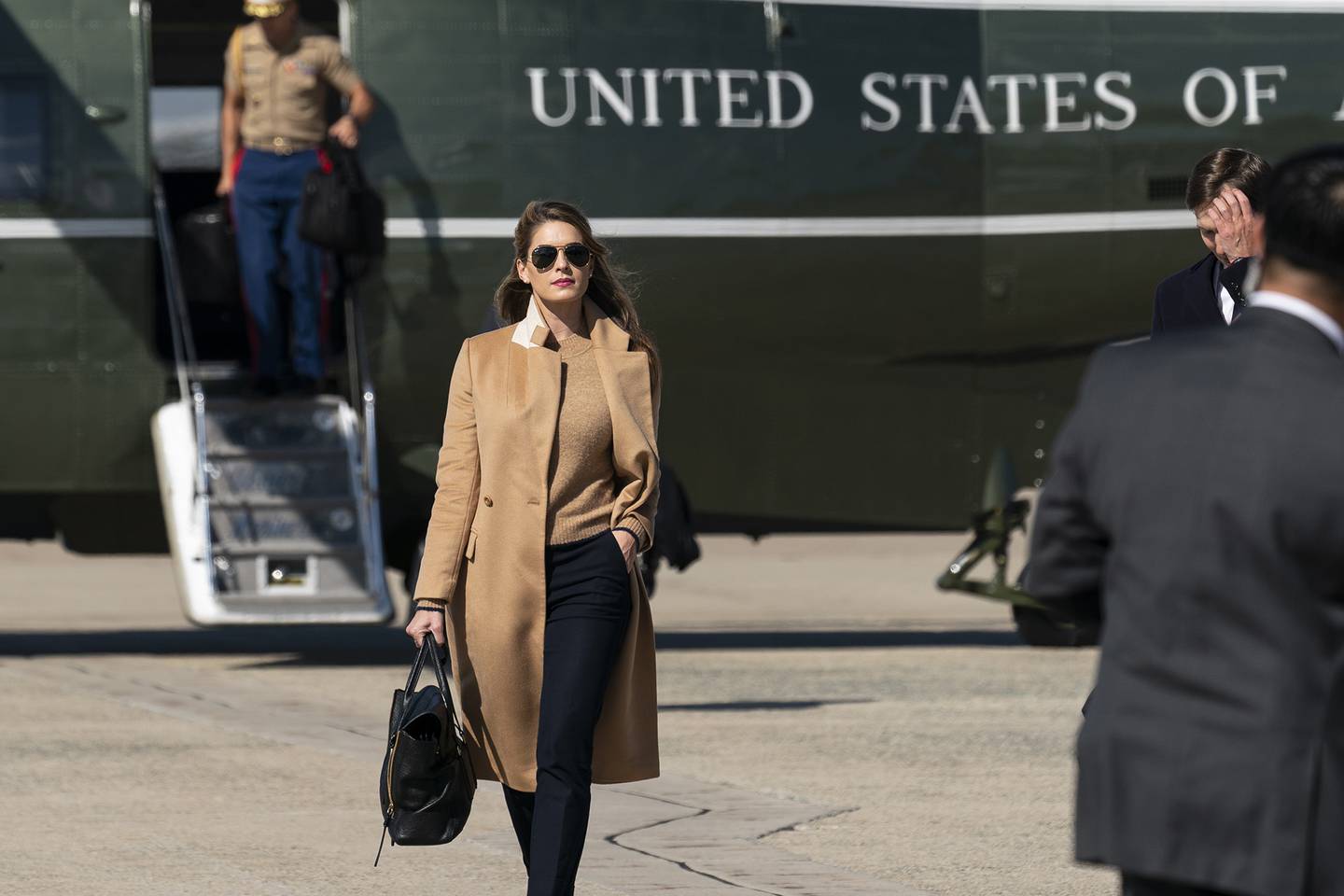 Counselor to the President Hope Hicks walks from Marine One to accompany President Donald Trump aboard Air Force One as he departs Wednesday, Sept. 30, 2020, at Andrews Air Force Base, Md.