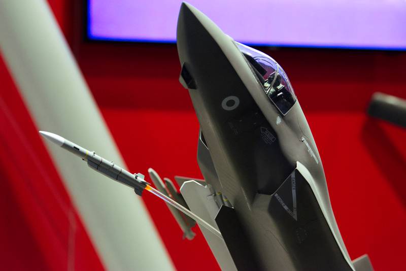 A miniature missile launches from a model fighter jet at the Sea-Air-Space conference in National Harbor, Maryland, in April 2023.