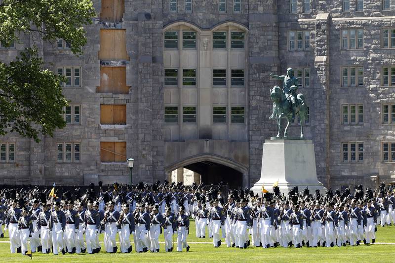In this May 22, 2019, file photo, members of the senior class march past a statue of George Washington during Parade Day at the U.S. Military Academy in West Point, N.Y.