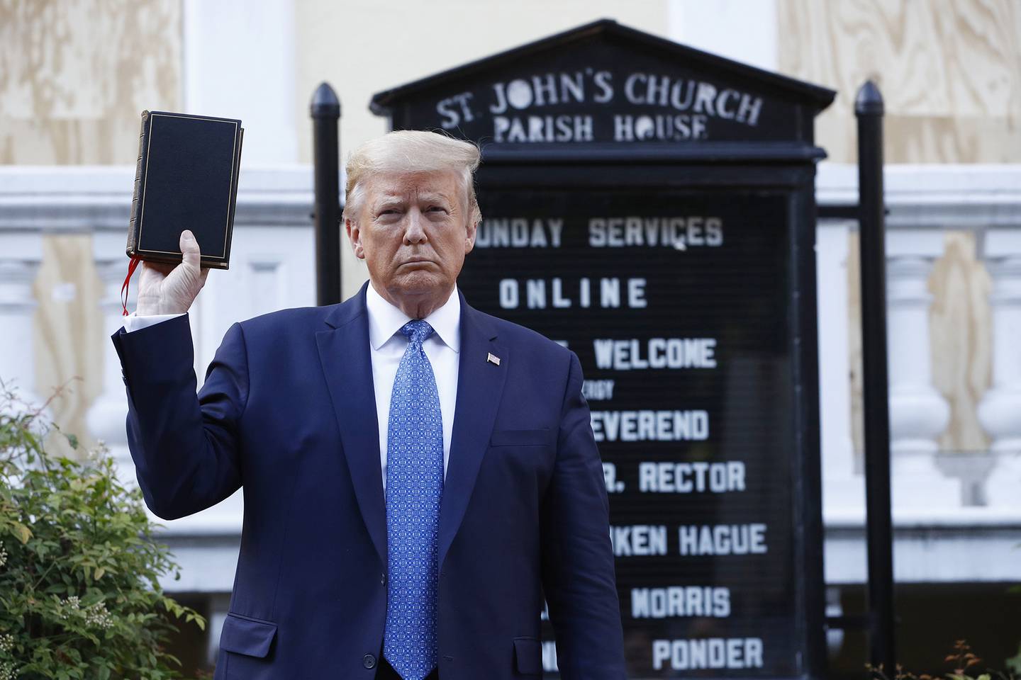 President Donald Trump holds a Bible as he visits outside St. John's Church across Lafayette Park from the White House Monday, June 1, 2020, in Washington.