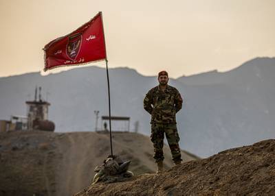 Afghan National Army soldier stand on top of a hill during a visit by Afghan Deputy Defense Minister Dr. Yasin Zia and Resolute Support Commander Gen. Scott Miller in Kabul, Afghanistan, March 3, 2020.