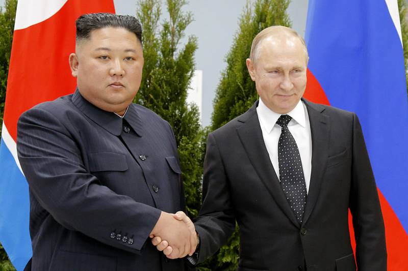 Russian President Vladimir Putin, right, and North Korea's leader Kim Jong Un shake hands during their meeting in Vladivostok, Russia on April 25, 2019.