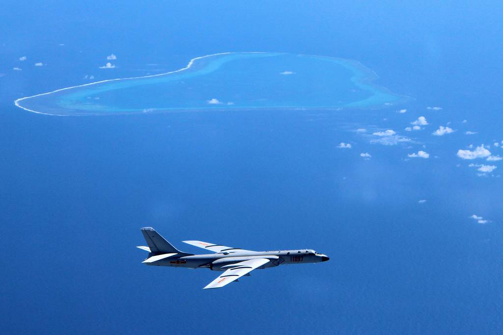 A Chinese H-6K bomber patrols the islands and reefs in the South China Sea in this undated photo.