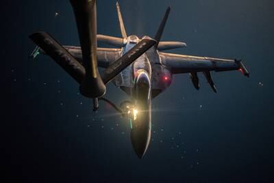 A U.S. Navy F/A-18E Super Hornet is refueled over the U.S. Central Command area of responsibility by a U.S. Air Force KC-135 Stratotanker, Sept. 22, 2020.
