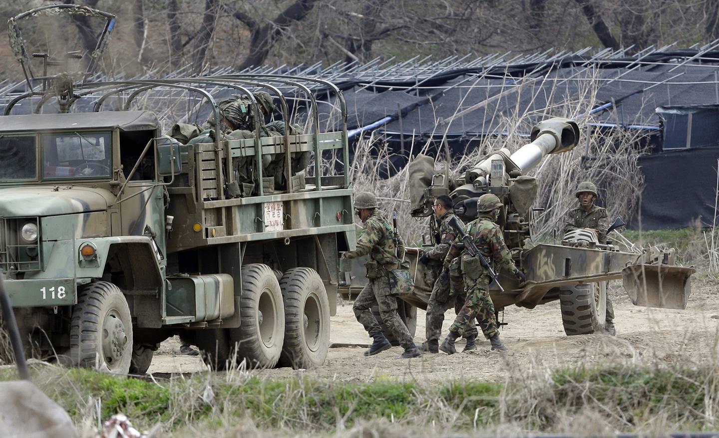 South Korean soldiers prepare 155 mm howitzers during their military exercise in the border city between two Koreas, Paju, north of Seoul, South Korea, on April 18, 2013.