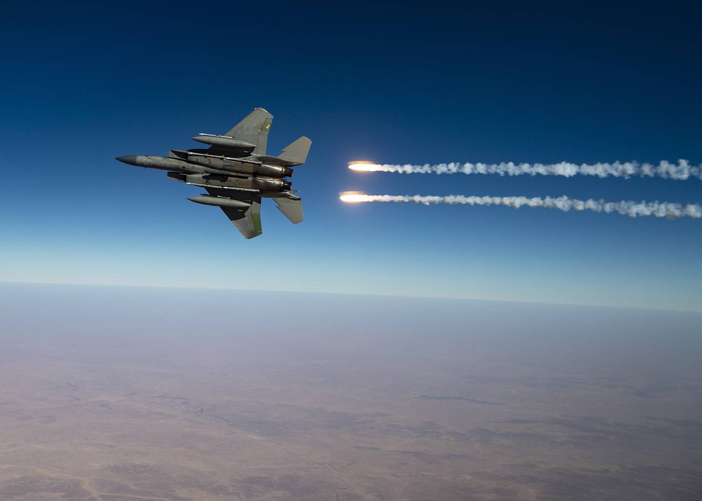 A U.S. Air Force F-15C Eagles release flares over the U.S. Central Command area of responsibility Aug. 13, 2020