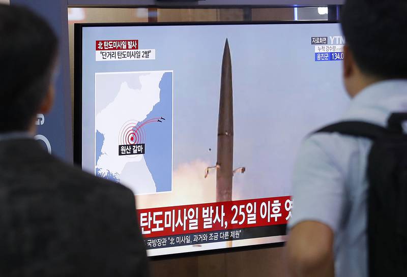 People watch a TV showing a file image of North Korea's missile launch during a news program at the Seoul Railway Station in Seoul, South Korea, Wednesday, July 31, 2019.