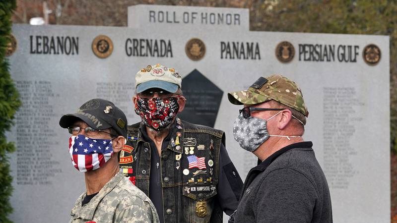 Veterans, wearing protective masks due to the COVID-19 virus outbreak, gather during a Veterans Day ceremony, Wednesday, Nov. 11, 2020, in Derry, N.H.