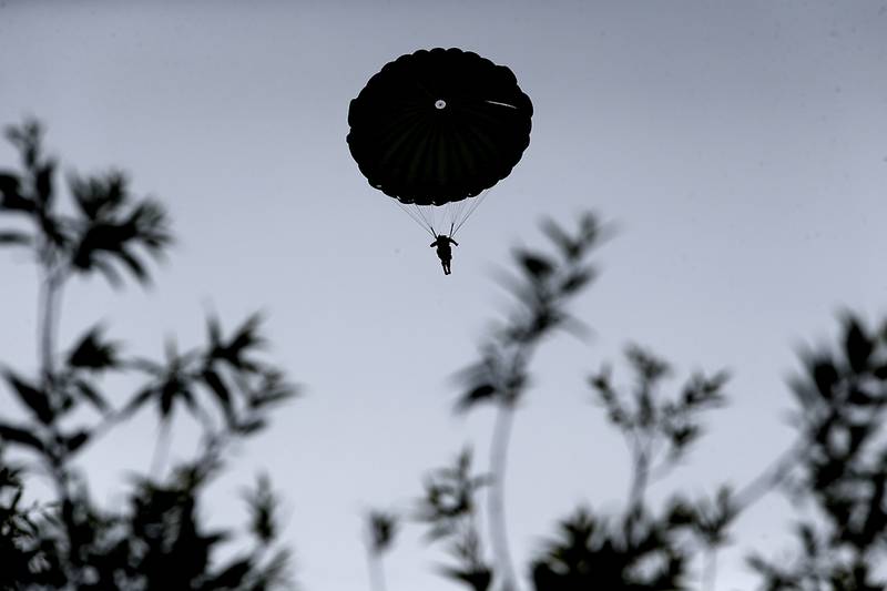 Parachutists jump from C-47 transport planes in Carentan, Normandy, France