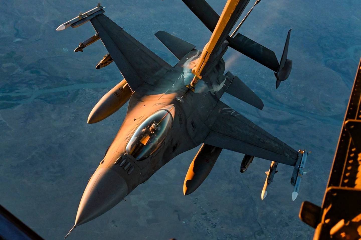 A U.S. Air Force F-16 Fighting Falcon connects with a U.S. Air Force KC-10 Extender over Iraq, Nov. 5, 2021. The F-16 is a compact, multi-role fighter aircraft that delivers war-winning airpower to U.S. Central Command. (Staff Sgt. Jerreht Harris/Air Force)