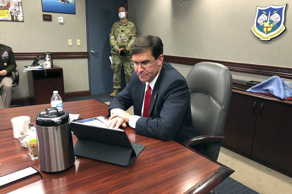 Defense Secretary Mark Esper speaks by video teleconference from U.S. Northern Command in Colorado Springs, Colo., on Thursday, May 7, 2020, with military medical specialists at civilian hospitals in New York and Connecticut.