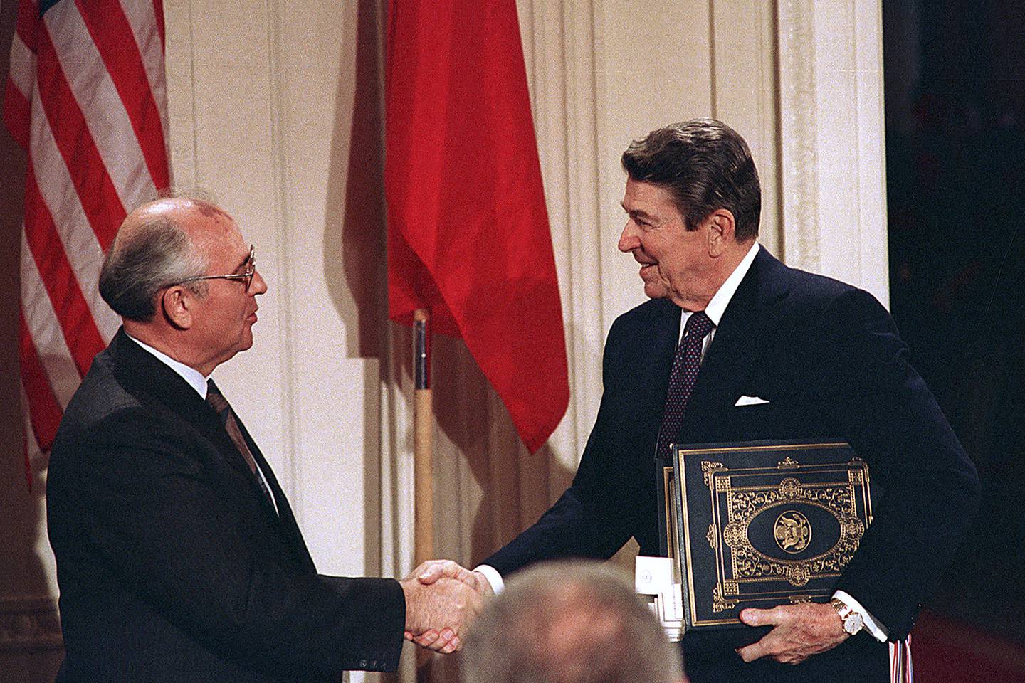 In this Dec. 8, 1987, file photo, President Ronald Reagan, right, shakes hands with Soviet leader Mikhail Gorbachev after the two leaders signed the Intermediate Range Nuclear Forces Treaty to eliminate intermediate-range missiles during a ceremony in the White House East Room in Washington.