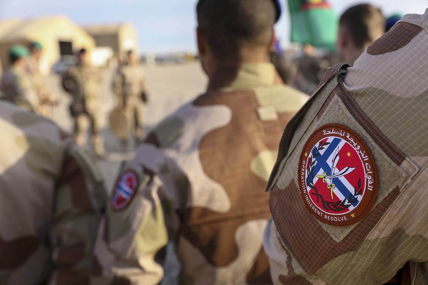 Norwegian soldiers of the outgoing Norwegian ROTO 5 Battalion conduct a transfer of authority ceremony with the incoming ROTO 6 Battalion at Al Asad Air Base, Iraq, Feb. 15, 2020.