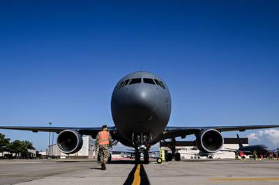 An airman assigned to the 305th Air Mobility Wing approaches a KC-46A Pegasus on Joint Base McGuire-Dix-Lakehurst, N.J., Jun. 17, 2022. (Senior Airman Joseph Morales/Air Force)