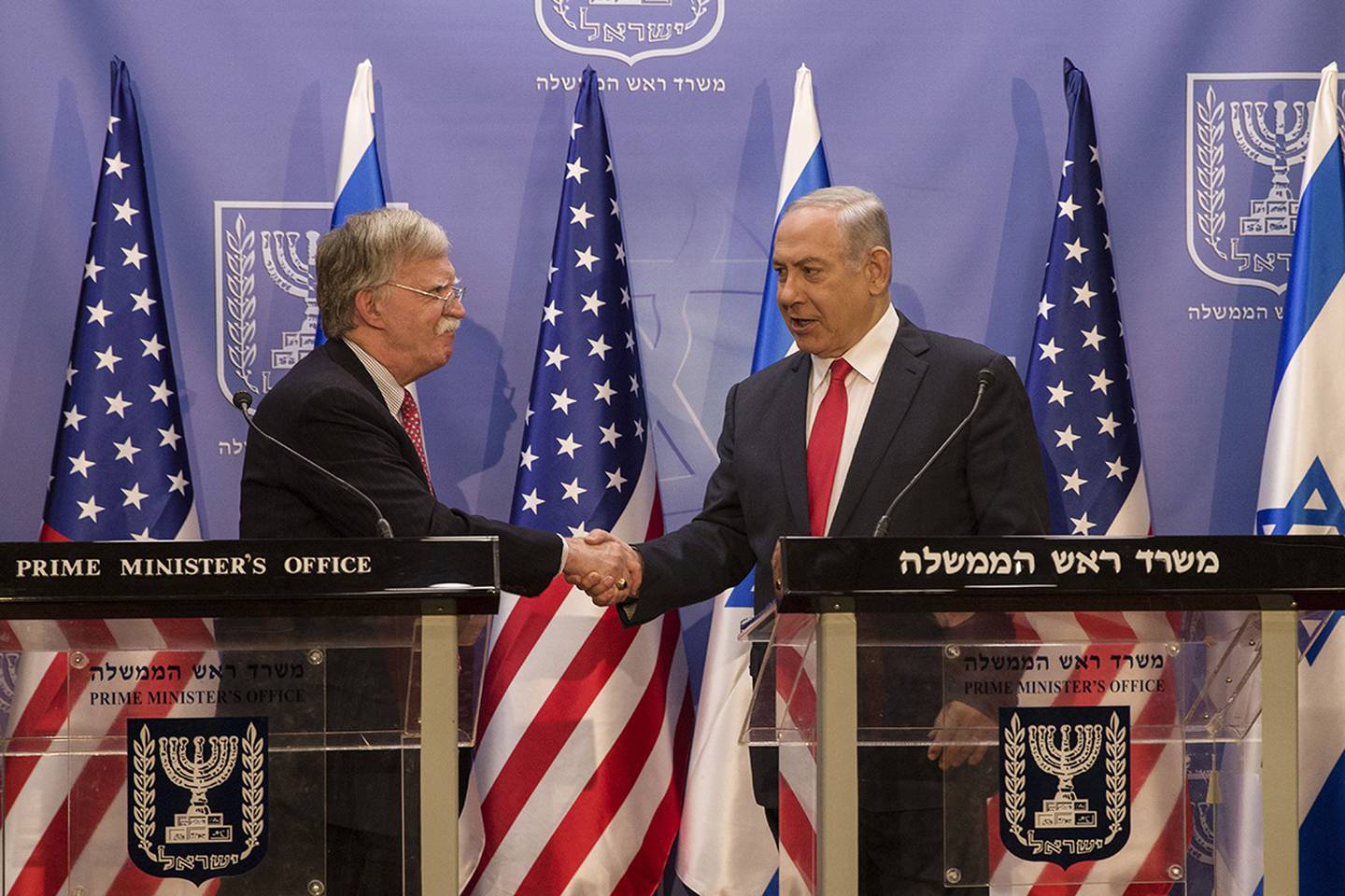 Israeli Prime Minister Benjamin Netanyahu, right, shakes hands with U.S. National Security Adviser John Bolton in Jerusalem