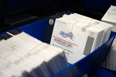 In this Oct. 23, 2020, file photo, mail-in ballots for the 2020 general election in the United States are seen after being sorted at the Chester County Voter Services office, in West Chester, Pa.