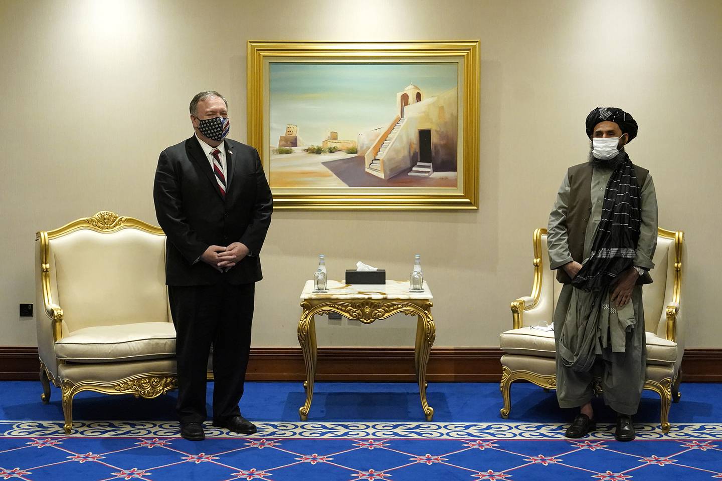 Secretary of State Mike Pompeo meets with Mullah Abdul Ghani Baradar, head of the Taliban's peace negotiation team, amid talks between the Taliban and the Afghan government, Saturday, Nov. 21, 2020, in Doha, Qatar.