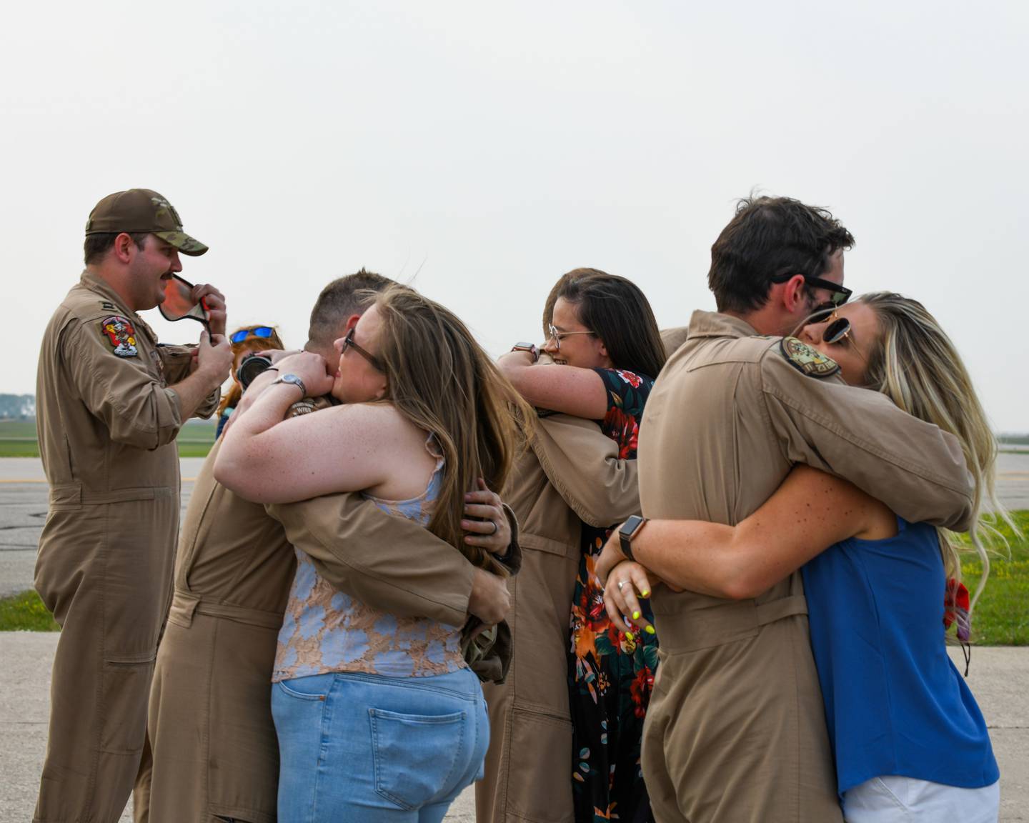 Spouses at Minot Air Force Base, North Dakota, reunited with their husbands who safely returned from deployment on Sept. 10, 2021. The aircrews that arrived were from the 23rd Bomb Squadron. (Airman 1st Class Saomy Sabournin/Air Force)