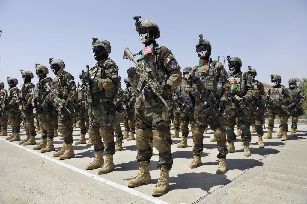 New Afghan Army special forces members attend their graduation ceremony after a three-month training program at the Kabul Military Training Center in Kabul, Afghanistan, Saturday, July 17, 2021.