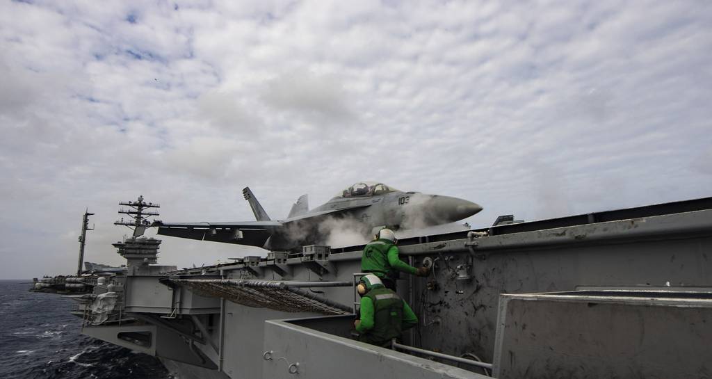 An F/A-18F Super Hornet launches off the flight deck of the aircraft carrier USS Nimitz (CVN 68) in the Arabian Sea on July 27, 2020.