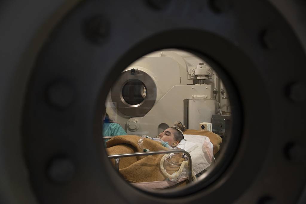 Jeremiah Harutyunyan, 11, sleeps through a session of ongoing hyperbaric oxygen treatment, Dec. 8, 2019, at David Grant U. S. Air Force Medical Center, Travis Air Force Base, Calif.