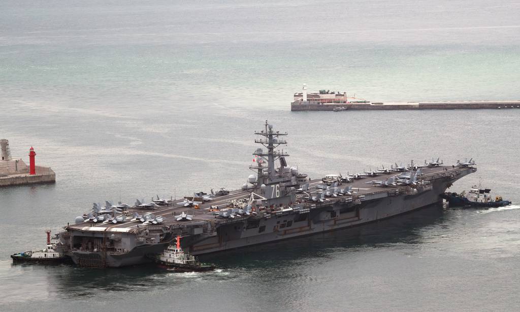 U.S. aircraft carrier USS Ronald Reagan leaves from a port in Busan, South Korea, Monday, Sept. 26, 2022.