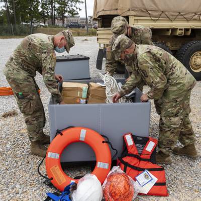 Mississippi Army National Guard Soldiers assigned to an engineer composite team pack supplies in preparation to conduct high-water rescues in response to Hurricane Sally at Camp Shelby Joint Force Training Center, Miss., Sept. 15, 2020. The Mississippi National Guard is prepared to conduct civil support operations, including search and rescue and debris removal, to support local and state authorities. (U.S. Army National Guard photo by Cdt. Jarvis Mace)