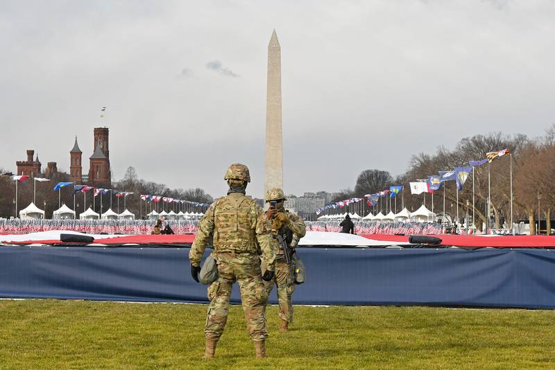 Members of the National Guard stand on the National Mall near the U.S. Capitol before the inauguration of President-elect Joe Biden and Vice President-elect Kamala Harris on Jan. 20, 2021, in Washington.