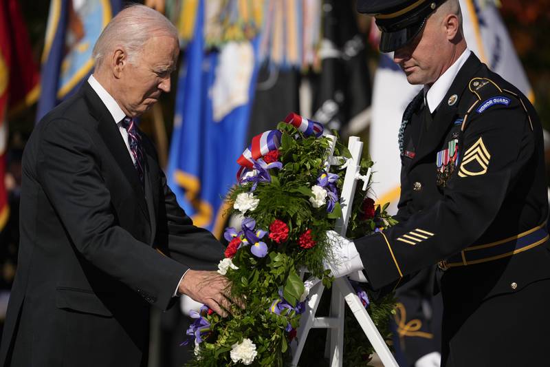 President Joe Biden lays a wreath at the Tomb of the Unknown Soldier at Arlington National Cemetery in Arlington, Va., Saturday, Nov. 11, 2023.