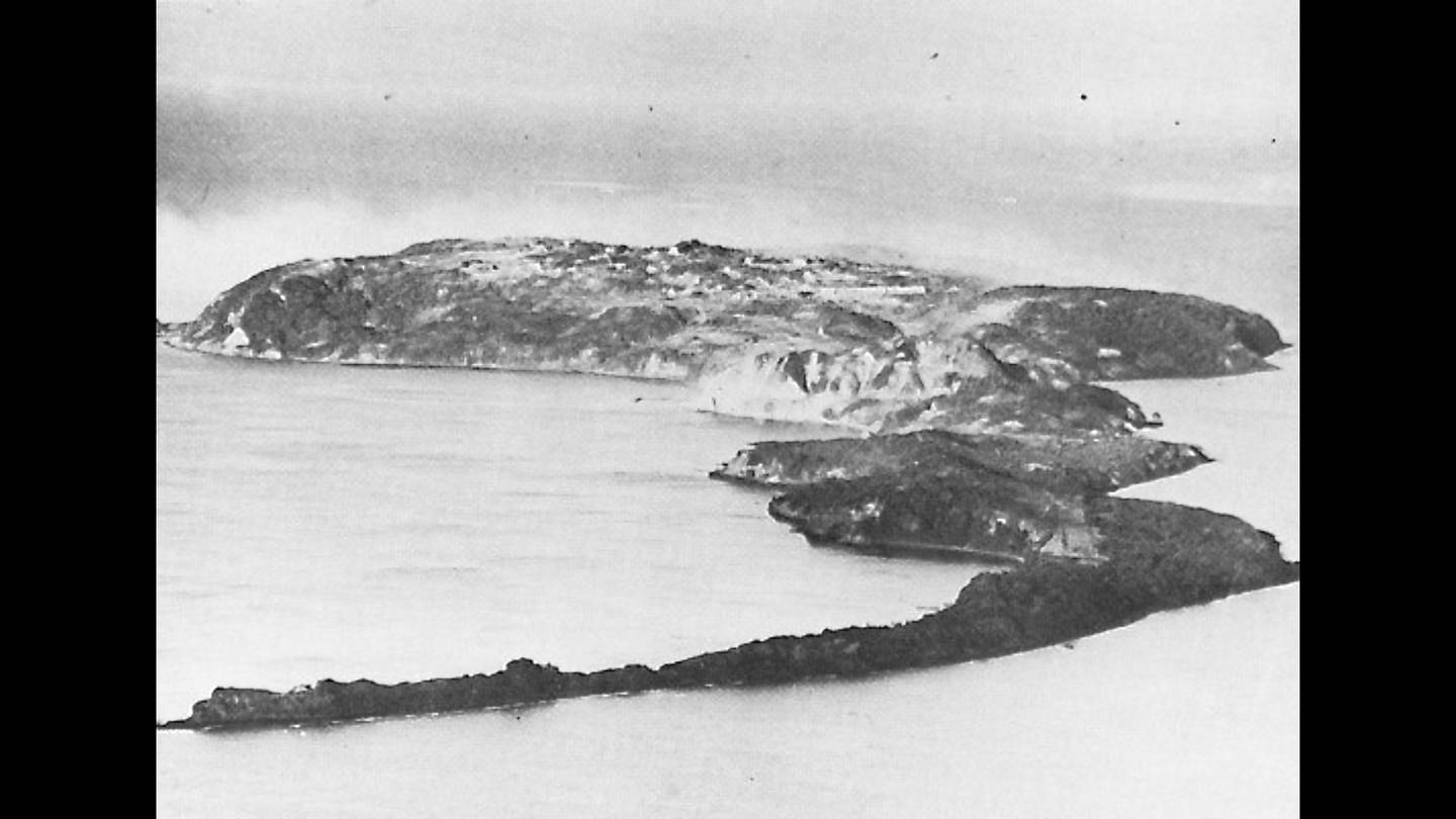 An aerial photograph of the rocky island of Corregidor, home to the underground headquarters of Fort Mills.