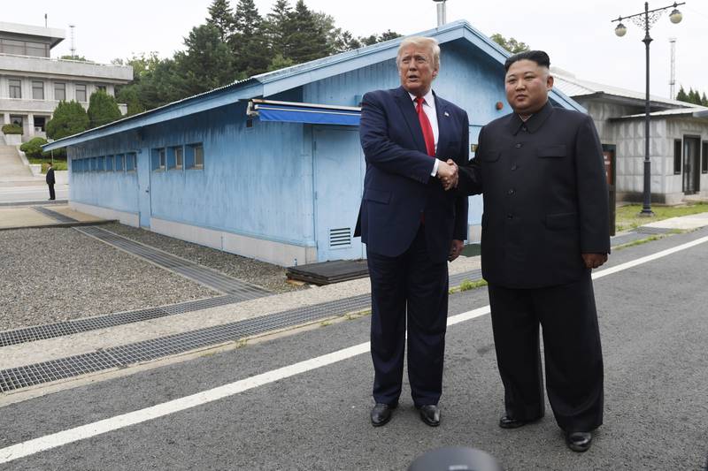 In this June 30, 2019, file photo, U.S. President Donald Trump, left, meets with North Korean leader Kim Jong Un at the border village of Panmunjom in the Demilitarized Zone, South Korea.