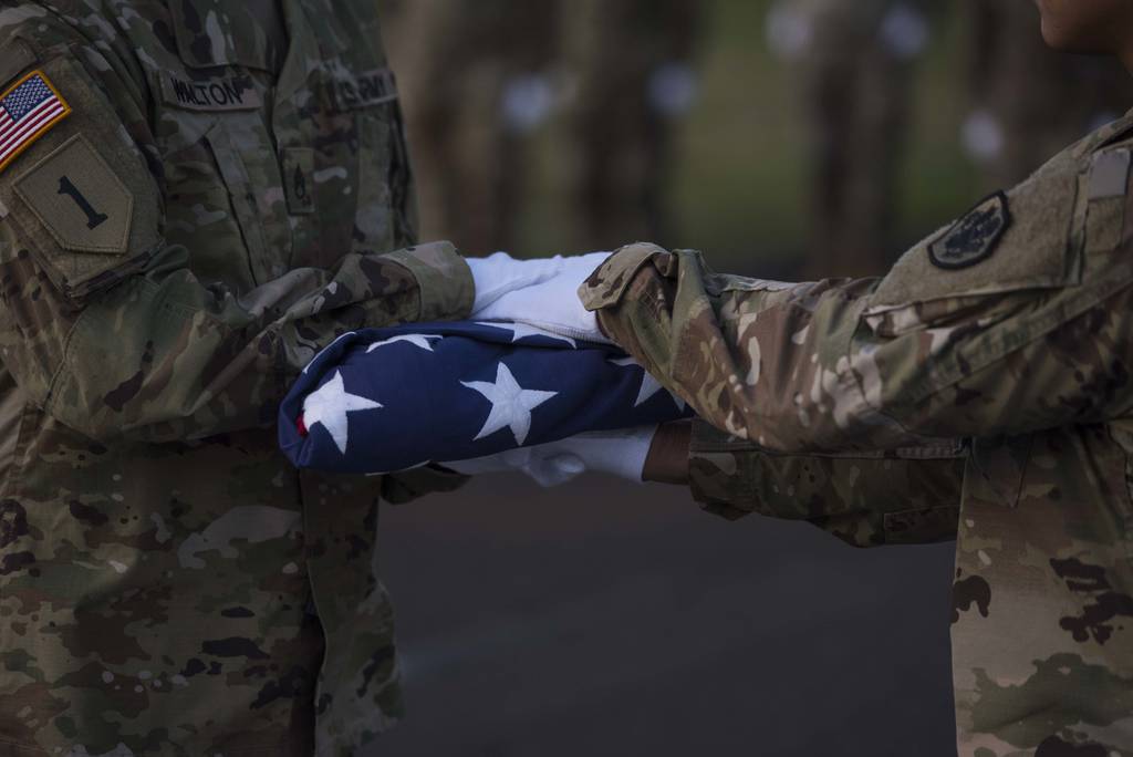 U.S. service members assigned to the Defense POW/MIA Accounting Agency participate in a disinterment ceremony held at the National Memorial Cemetery of the Pacific, Honolulu, Hawaii, Aug. 5, 2019.