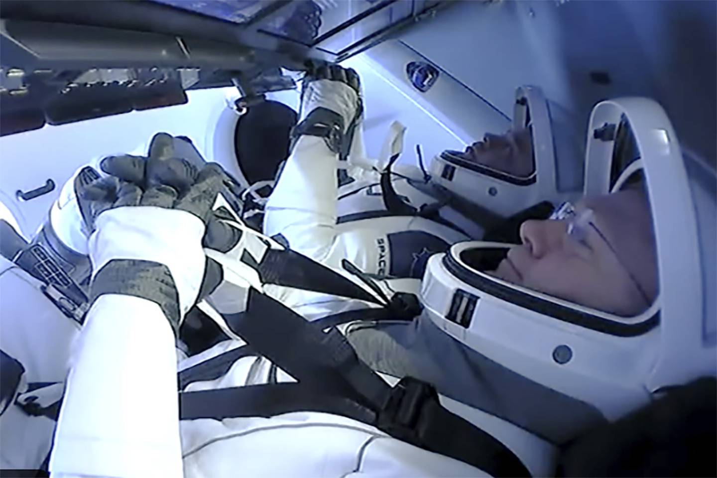 Astronauts Doug Hurley and Bob Behnken prepare to return to earth on a SpaceX capsule, Sunday, Aug. 2, 2020.