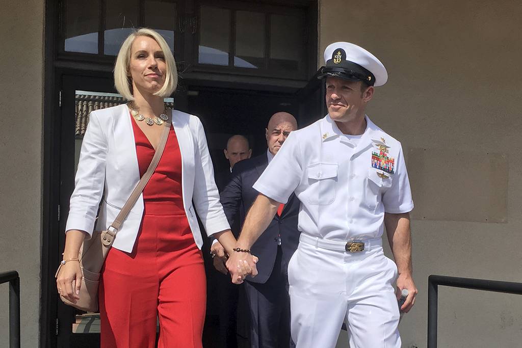 Navy Special Operations Chief Edward Gallagher leaves a military courtroom on Naval Base San Diego with his wife, Andrea Gallagher.