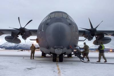 Airmen assigned to the 176th Maintenance Squadron, Alaska Air National Guard, check a HC-130J Combat King II prior to takeoff at Joint Base Elmendorf-Richardson, Alaska, Jan. 21, 2021. (Airman 1st Class Emily Farnsworth/Air Force)