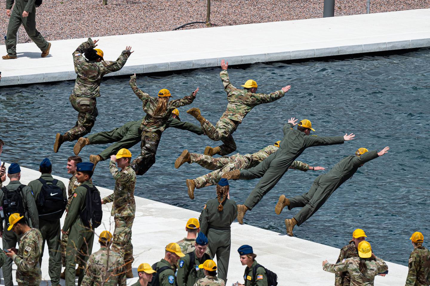 Prior to their upcoming graduation, senior Air Force Academy cadets continue the tradition of jumping into the Terazzo's Air Garden fountains to celebrate the completion of final exams at the Air Force Academy in Colorado Springs, Colo., on May 12, 2023.