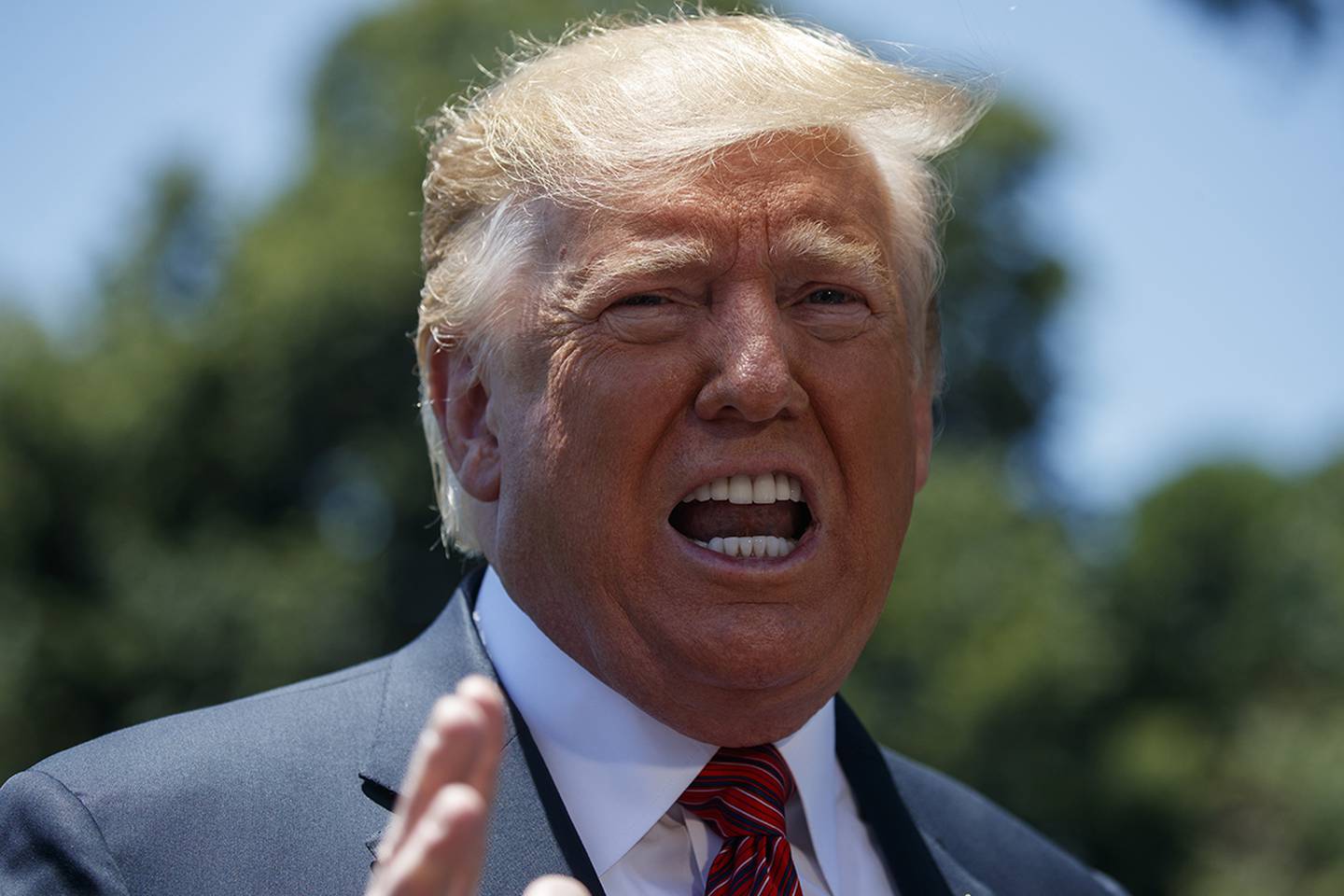 President Donald Trump speaks to reporters on the South Lawn of White House on June 11, 2019, in Washington.