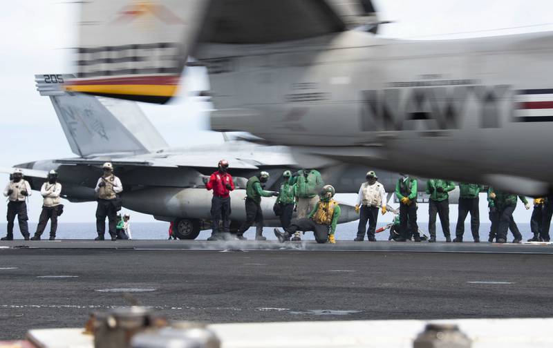 An E-2D Hawkeye launches from the flight deck of the aircraft carrier USS Ronald Reagan (CVN 76) during flight operations June 17, 2020, in the Philippine Sea.