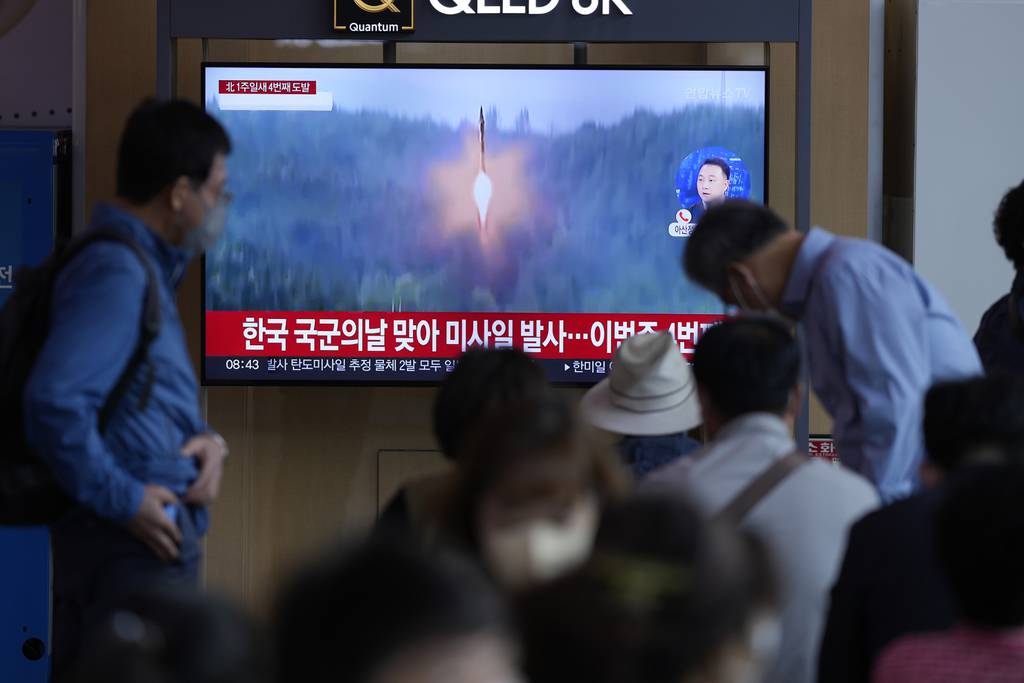 A TV screen showing a news program reporting about North Korea's missile launch with file footage, is seen at the Seoul Railway Station in Seoul, South Korea, Saturday, Oct. 1, 2022.