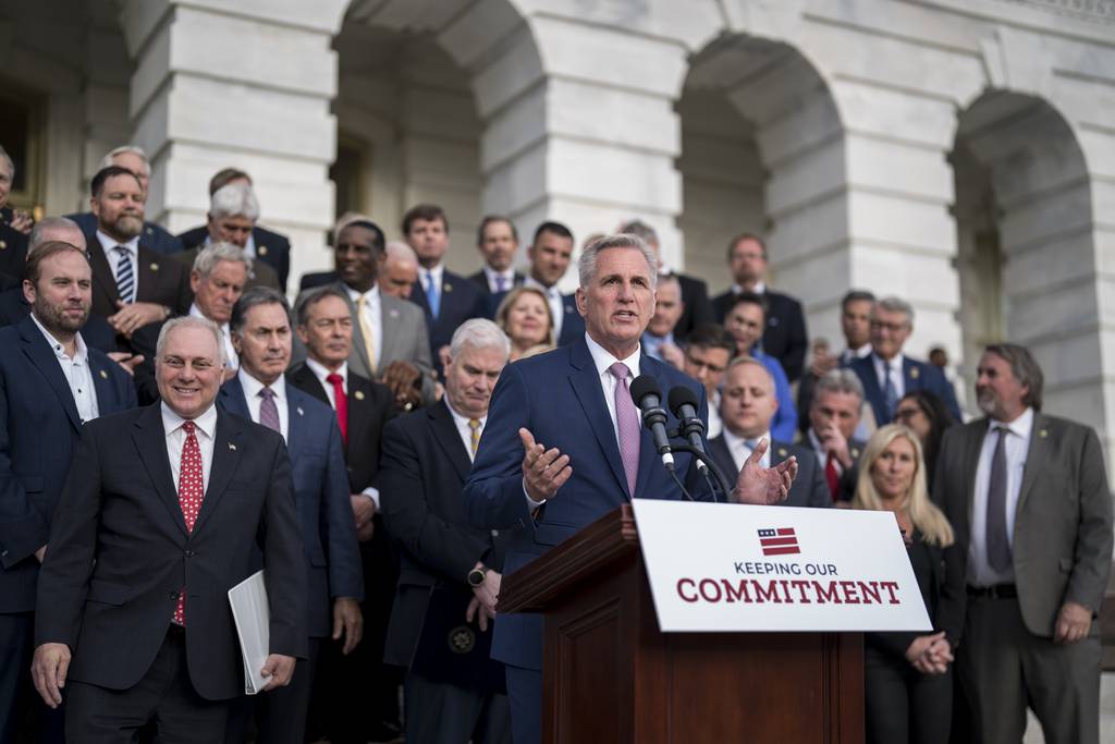 Speaker of the House Kevin McCarthy, R-Calif., joined at far left by House Majority Leader Steve Scalise, R-La., holds an event to mark 100 days of the Republican majority in the House, at the Capitol in Washington, Monday, April 17, 2023.