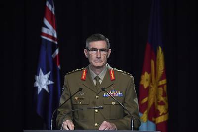 Chief of the Australian Defence Force Gen. Angus Campbell delivers the findings from the Inspector-General of the Australian Defence Force Afghanistan Inquiry, in Canberra, Thursday, Nov. 19, 2020.