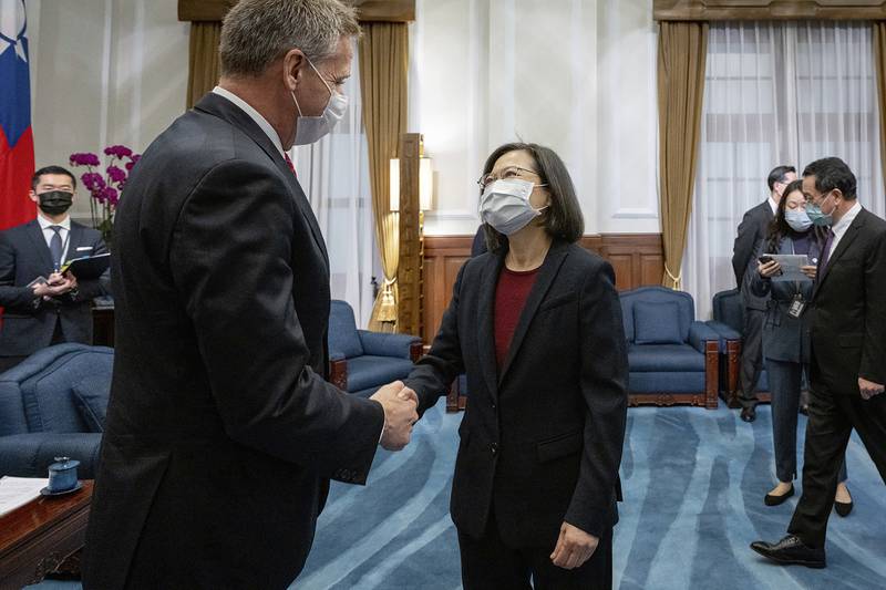 In this photo released by the Taiwan Presidential Office, Taiwan's President Tsai Ing-wen, right, meets with retired Adm. Phil Davidson, former head of the U.S. Inso-Pacific Command, in Taipei, Taiwan, Thursday, Feb. 2, 2023.
