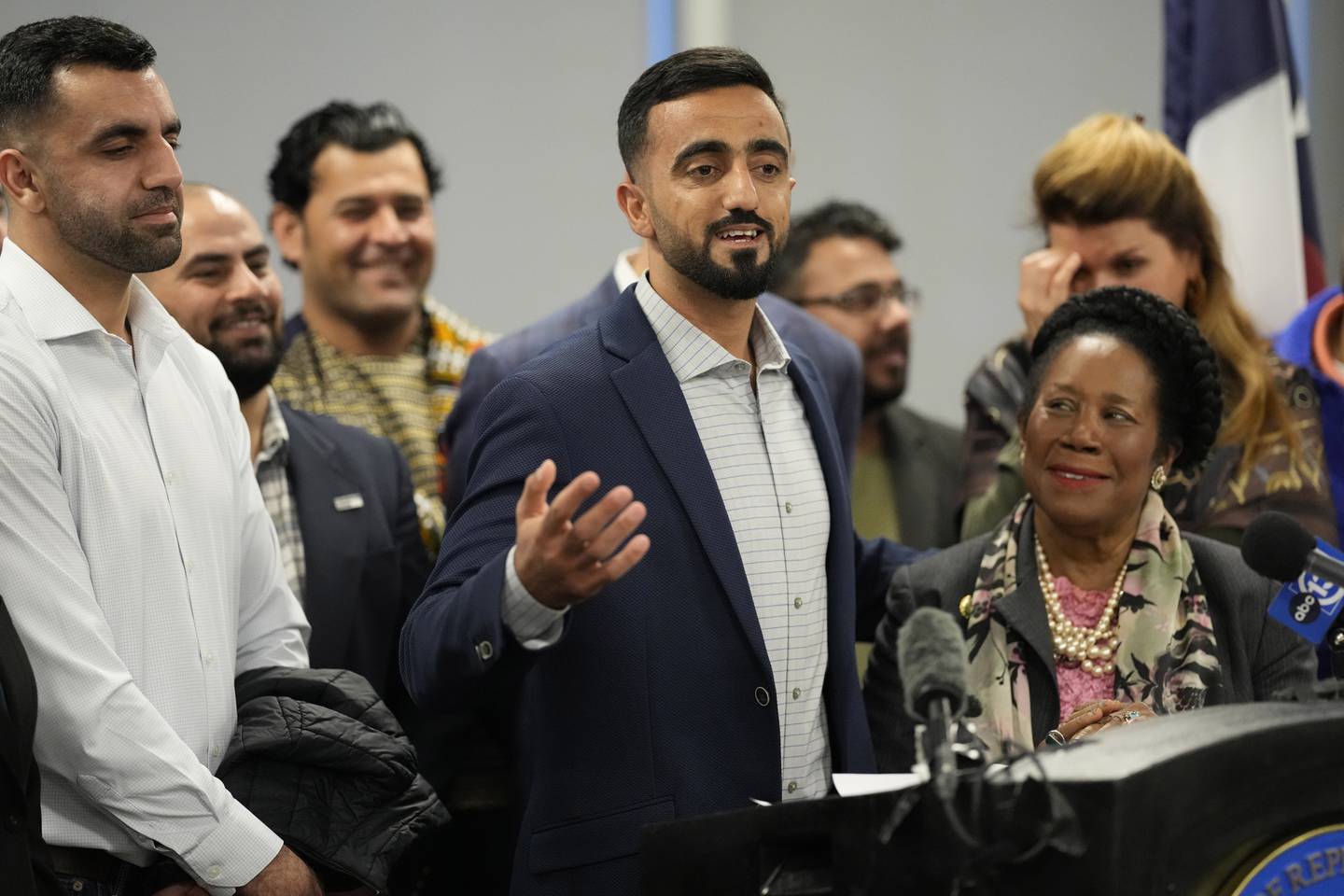 Abdul Wasi Safi, center, speaks as his brother, Sami-ullah Safi, left, and U.S. Rep. Sheila Jackson Lee, D-Texas, right, listen during a news conference Friday, Jan. 27, 2023, in Houston.