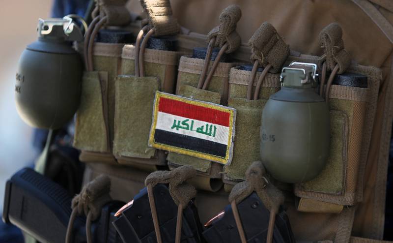 An Iraqi flag patched on the ammunition belt of a member of the Iraqi forces is seen June 19, 2017, during an offensive to retake the last district still held by the Islamic State group fighters in Mosul.