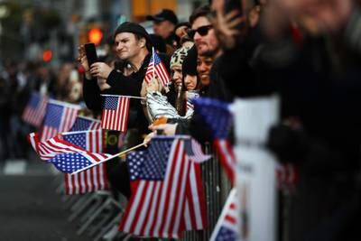 People watch the Veterans Day Parade on Nov. 11, 2019 in New York City.