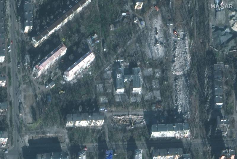 Satellite image shows demolition progress of damaged apartments on a street in Mariupol, Ukraine, Nov. 30, 2022.