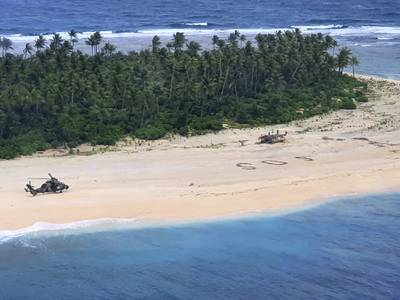n this photo provided by the Australian Defence Force, an Australian Army helicopter lands on Pikelot Island in the Federated States of Micronesia, where three men were found, Sunday, Aug. 2, 2020, safe and healthy after missing for three days.